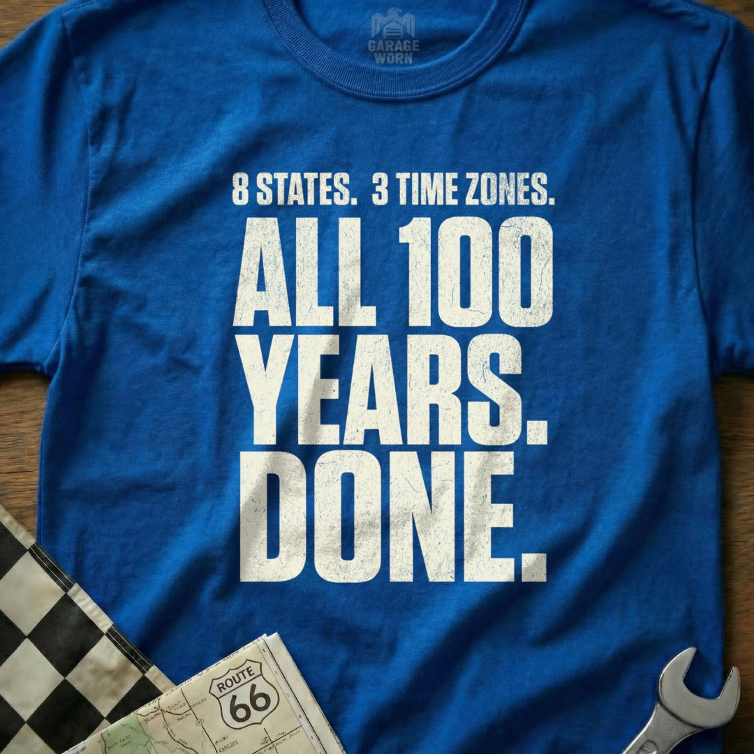 Blue t-shirt with "8 STATES. 3 TIME ZONES. ALL 100 YEARS. DONE." text.