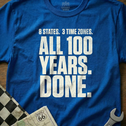 Blue t-shirt with "8 STATES. 3 TIME ZONES. ALL 100 YEARS. DONE." text.