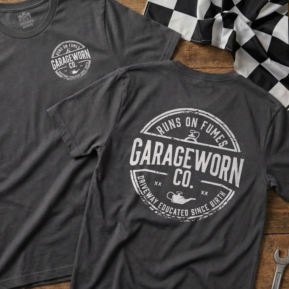 Charcoal t-shirt with "GarageWorn Co. Runs on Fumes Driveway Educated Since Birth" circular logo.
