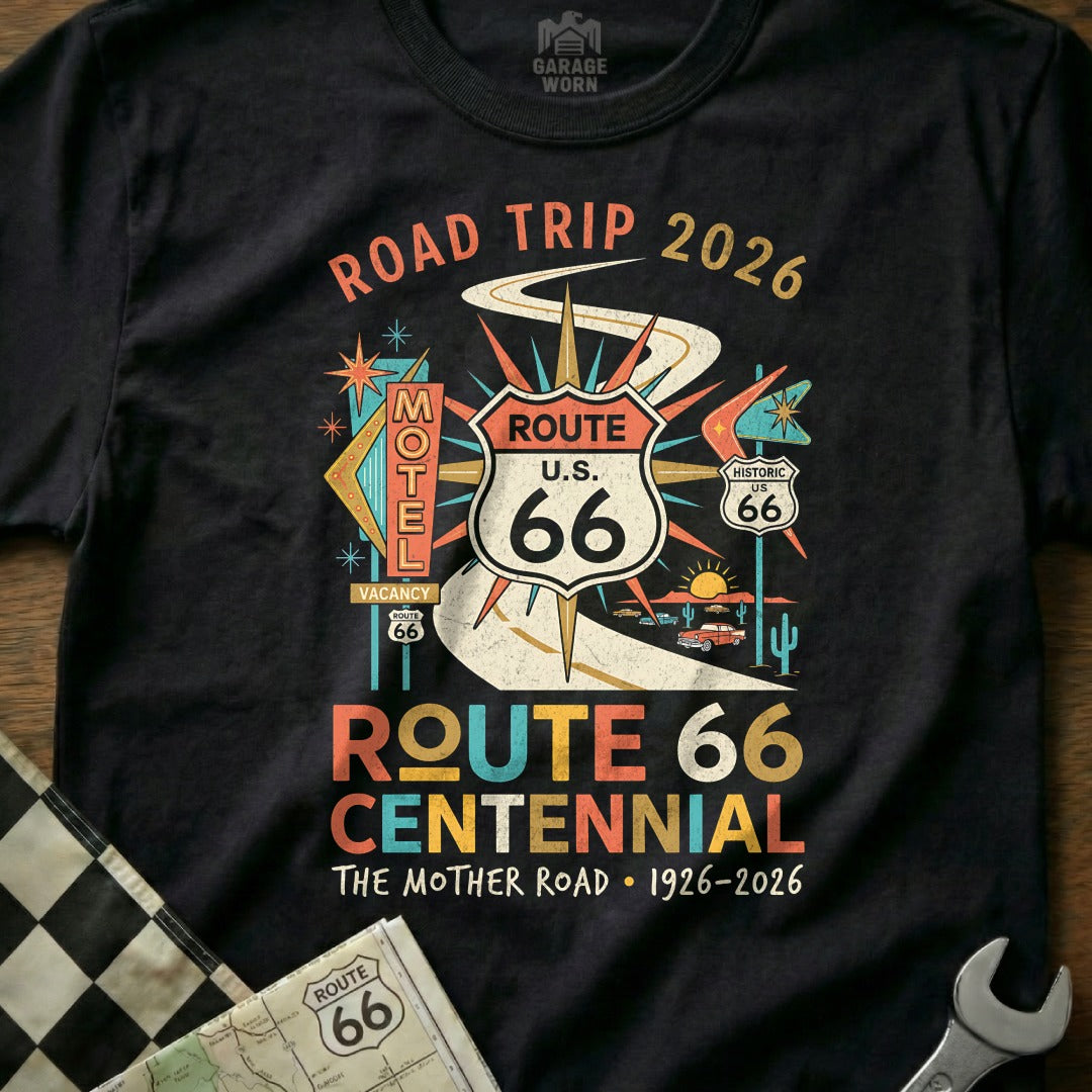 T-shirt featuring "Route 66 Centennial" with road signs and vintage motel.