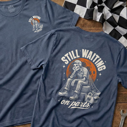 T-shirt with skeleton graphic: "Still Waiting on Parts" text and tire seat.