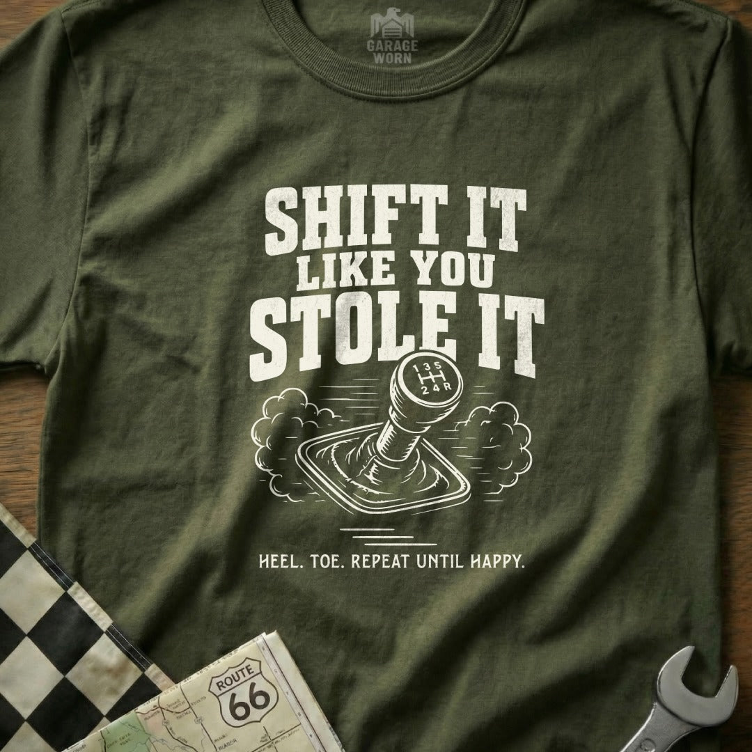 Olive t-shirt with "SHIFT IT LIKE YOU STOLE IT" and gear shift graphic.