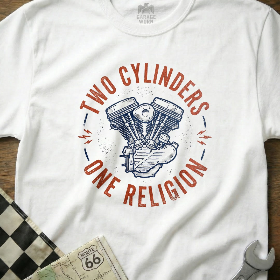 White t-shirt with "Two Cylinders, One Religion" and motorcycle engine graphic.