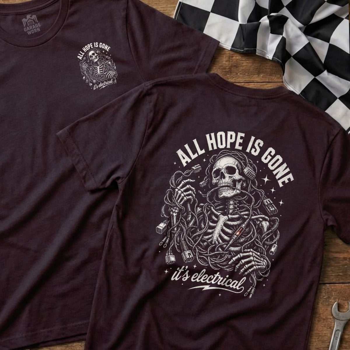 Dark t-shirt with skeleton entangled in wires graphic and text "ALL HOPE IS GONE it's electrical".