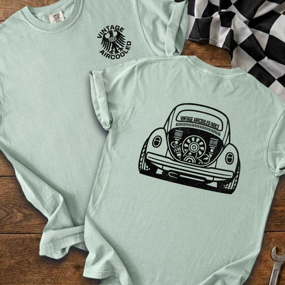Light green t-shirts with vintage air-cooled VW bug and eagle graphic.