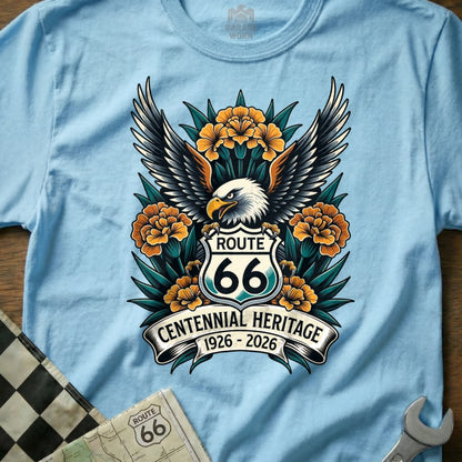 Route 66 Centennial Heritage 1926-2026 eagle graphic on a light blue t-shirt.