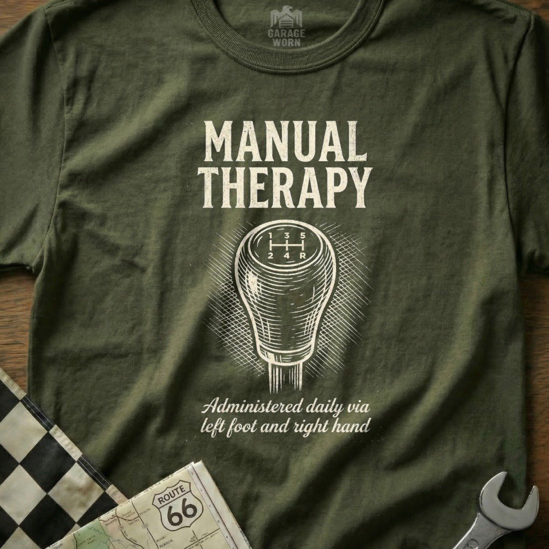 Olive t-shirt with "Manual Therapy" graphic, gear shift, and Route 66 map.