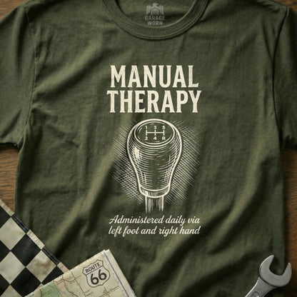 Olive t-shirt with "Manual Therapy" graphic, gear shift, and Route 66 map.