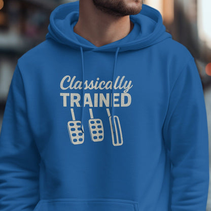Blue hoodie with "Classically TRAINED" text and three manual car pedals.
