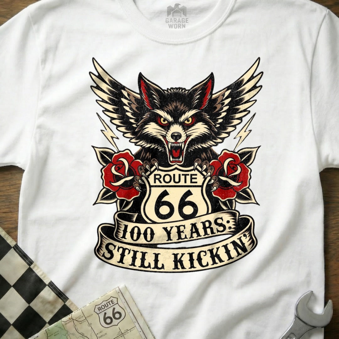 White t-shirt with Route 66 100 Years Still Kickin' wolf and roses graphic.