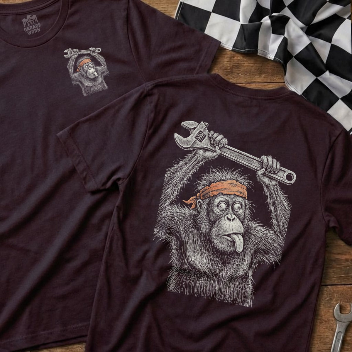 T-shirt with orangutan holding a wrench, tongue sticking out.