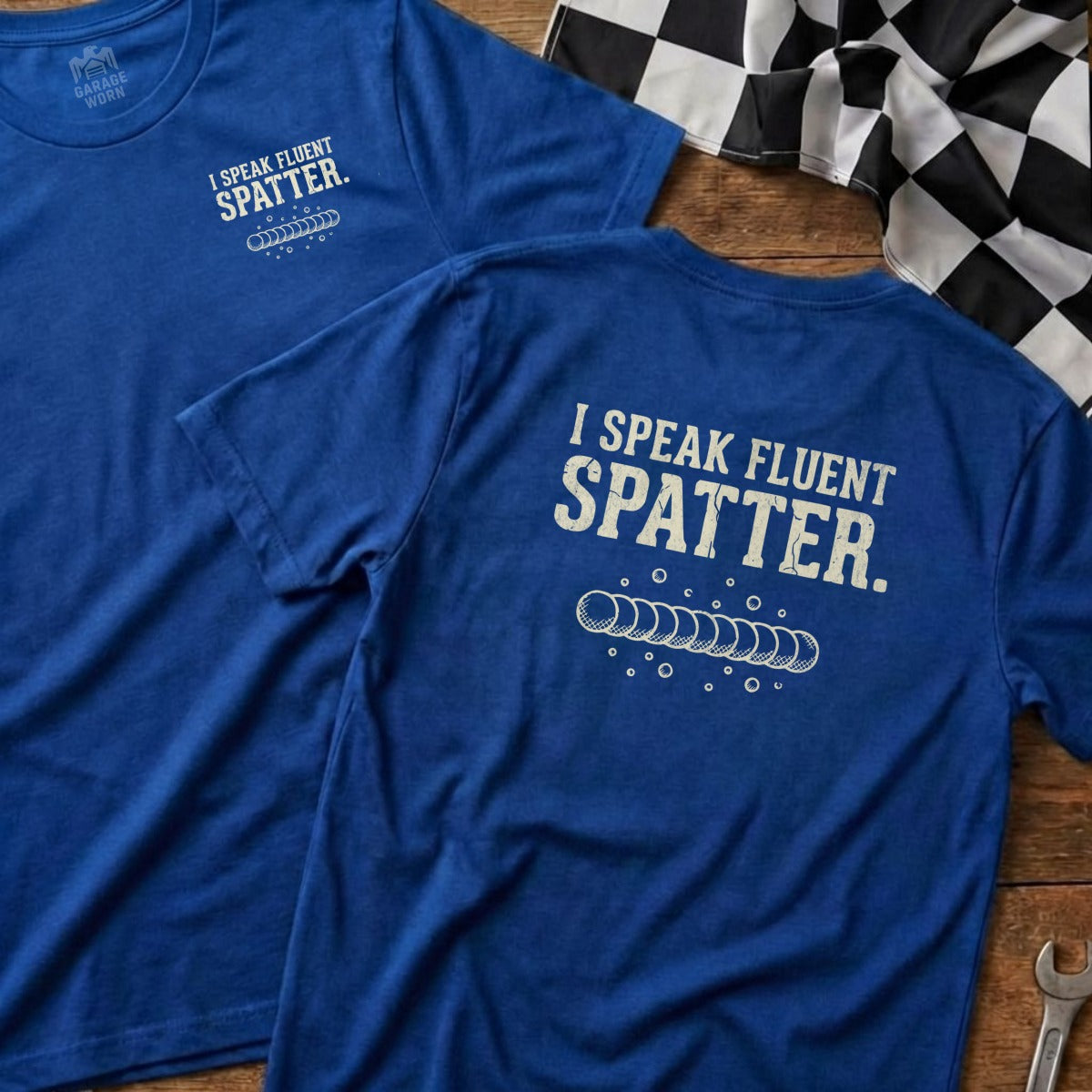 Blue t-shirt with "I SPEAK FLUENT SPATTER" and a graphic of golf balls.