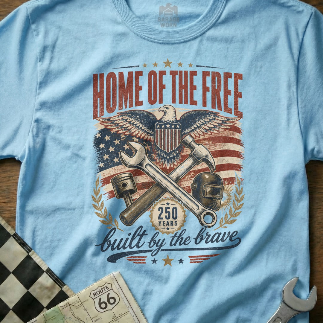 Light blue t-shirt with "Home of the Free" and patriotic imagery.
