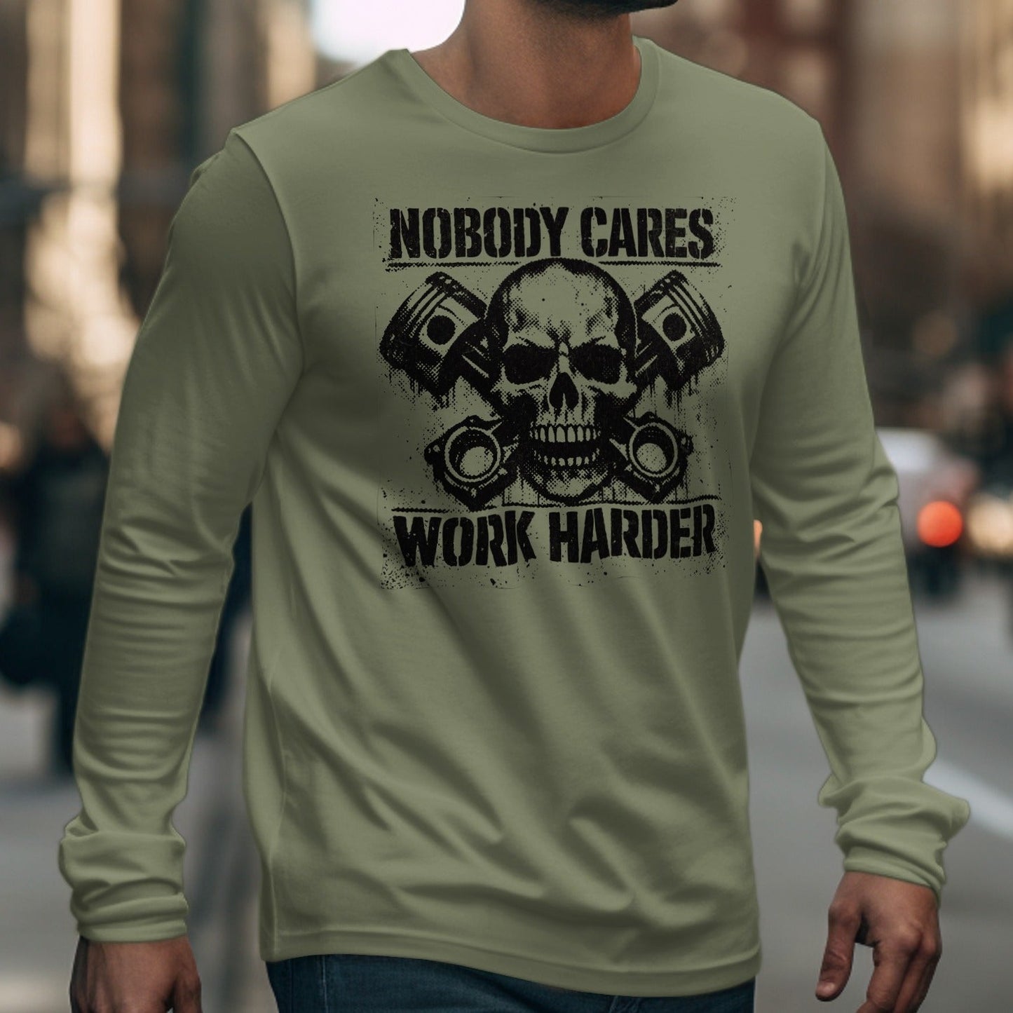 Long sleeve shirt with skull, pistons, and text "Nobody Cares Work Harder".