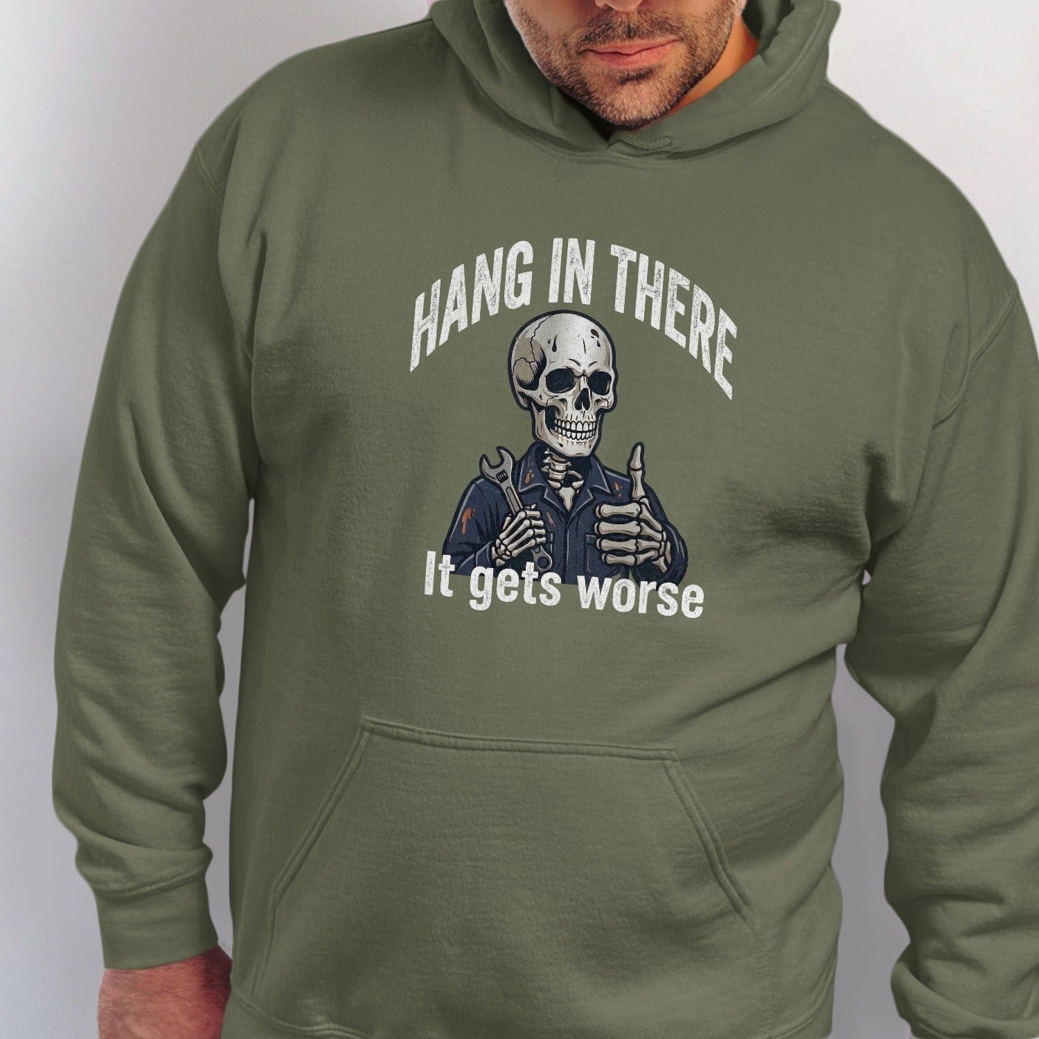 Skeleton mechanic giving a thumbs up with "Hang in there. It gets worse" text.