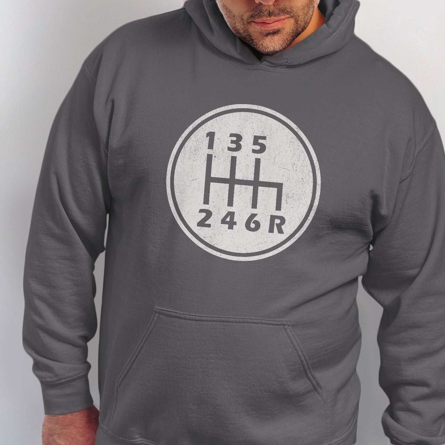 Grey hoodie with a circular graphic of a six-speed manual transmission shift pattern.