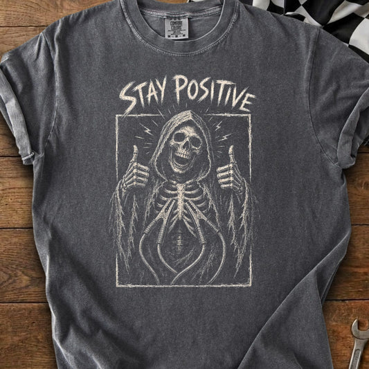 Grim reaper skeleton with thumbs up and "STAY POSITIVE" text.