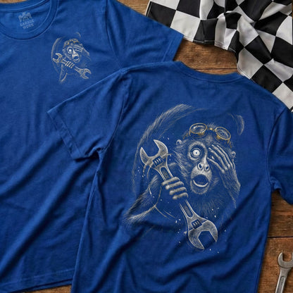 Blue t-shirt with a monkey holding a wrench and looking surprised.