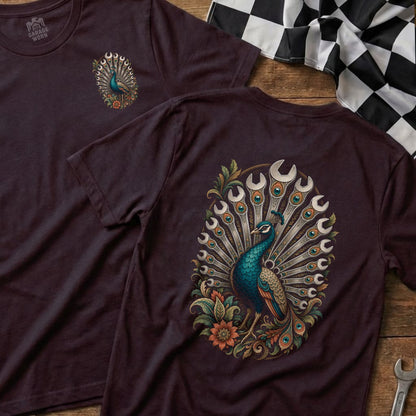 T-shirt with a peacock graphic featuring wrenches incorporated into its tail feathers.
