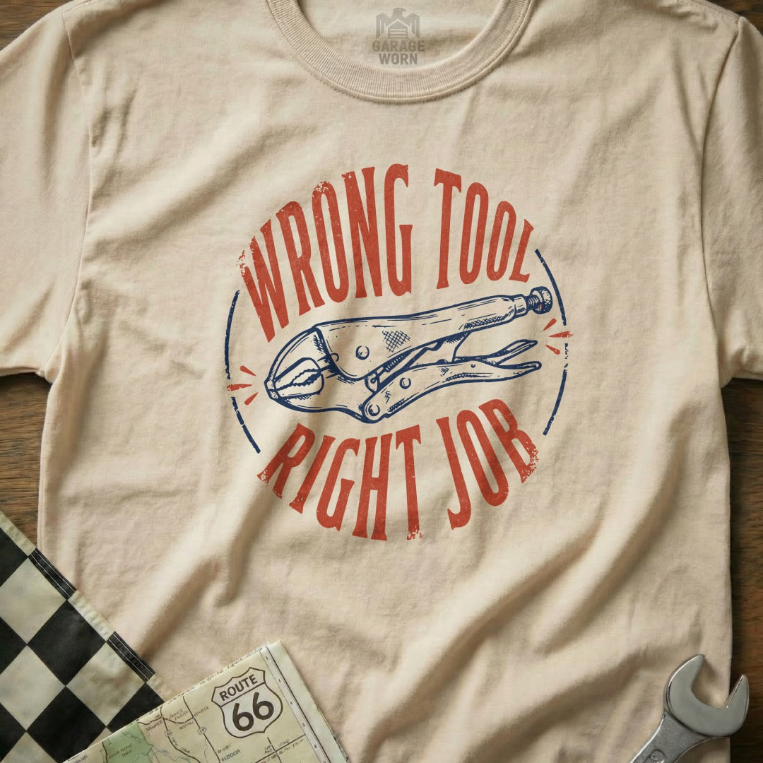 Cream t-shirt with "WRONG TOOL RIGHT JOB" and pliers graphic.