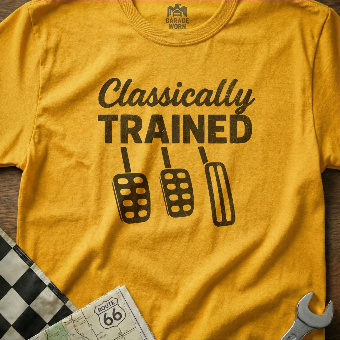 Yellow t-shirt with "Classically Trained" text and car pedals.