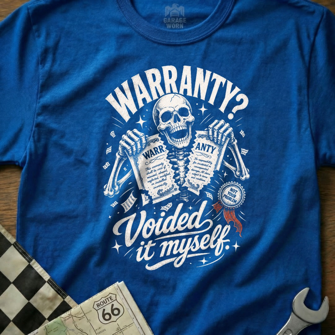 Blue t-shirt graphic of a skeleton ripping a warranty with text "Voided it myself".