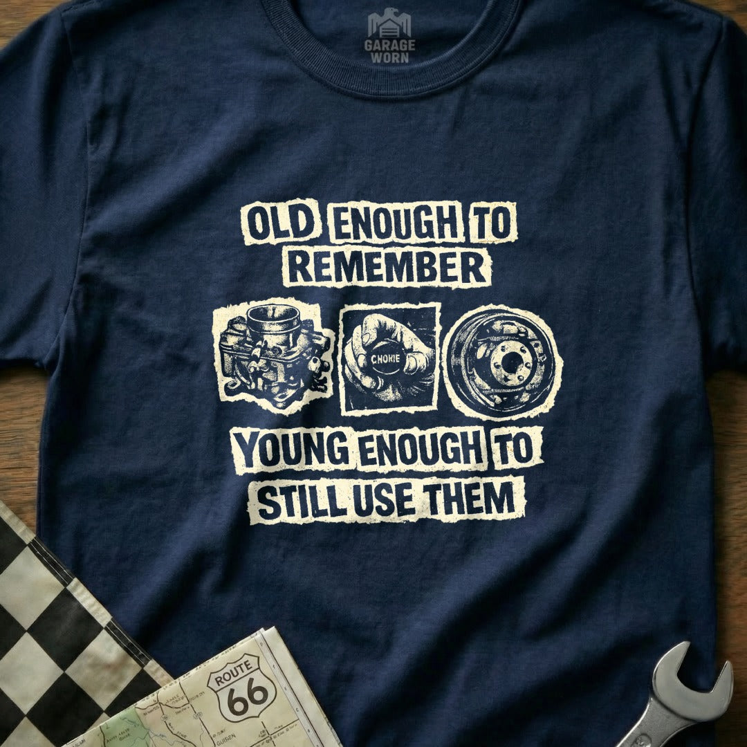 Navy t-shirt with "Old enough to remember, young enough to still use them" and engine parts.