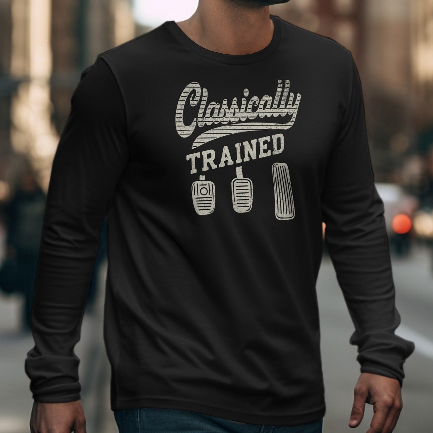 Black long-sleeve shirt with "Classically TRAINED" and three car pedal graphics.