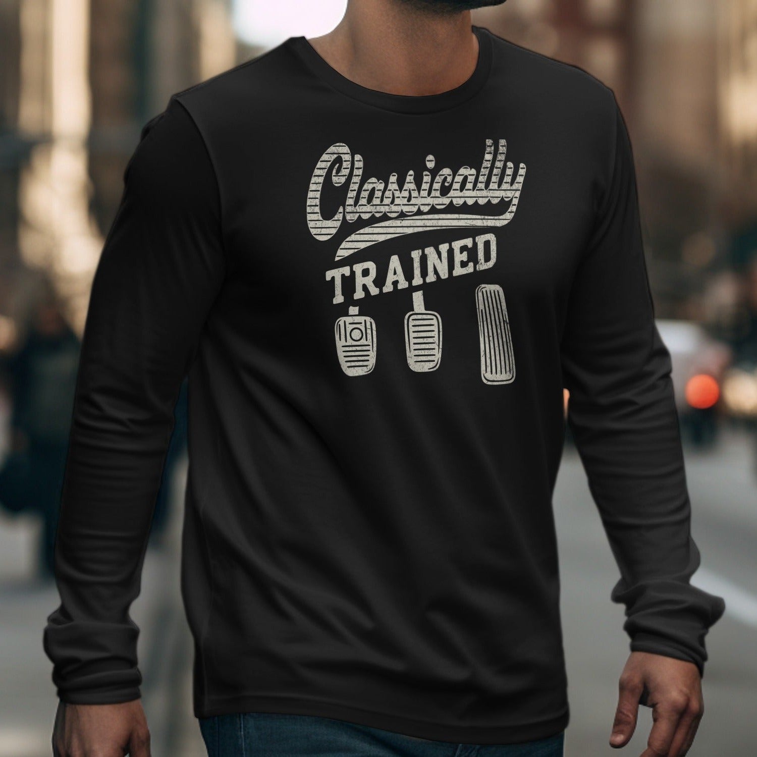 Black long-sleeve shirt with "Classically TRAINED" and three car pedal graphics.