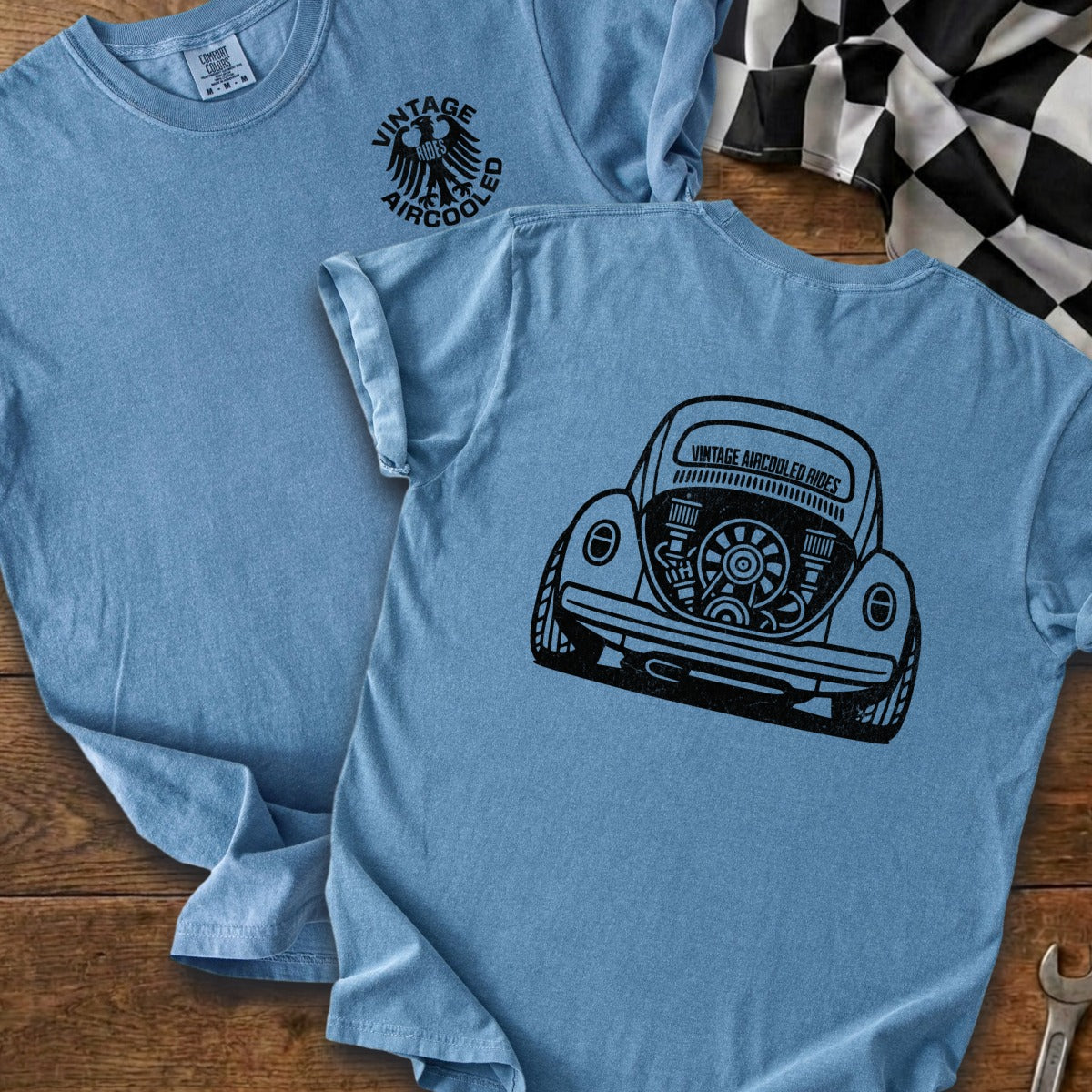 Light blue t-shirt with black graphic of a vintage Volkswagen Beetle engine.