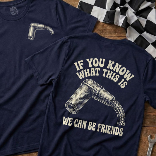 Two navy t-shirts, one showing a spark plug with text "IF YOU KNOW WHAT THIS IS WE CAN BE FRIENDS".