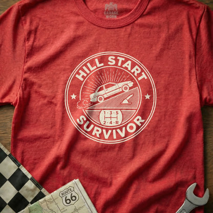 Red t-shirt with "Hill Start Survivor" text and gear diagram.