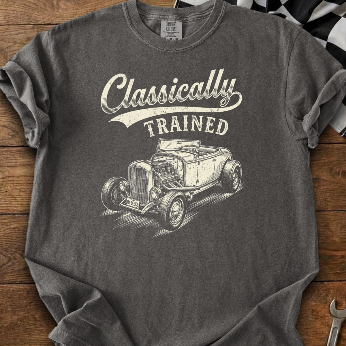 Dark gray t-shirt with white graphic of a vintage convertible and text "Classically TRAINED".