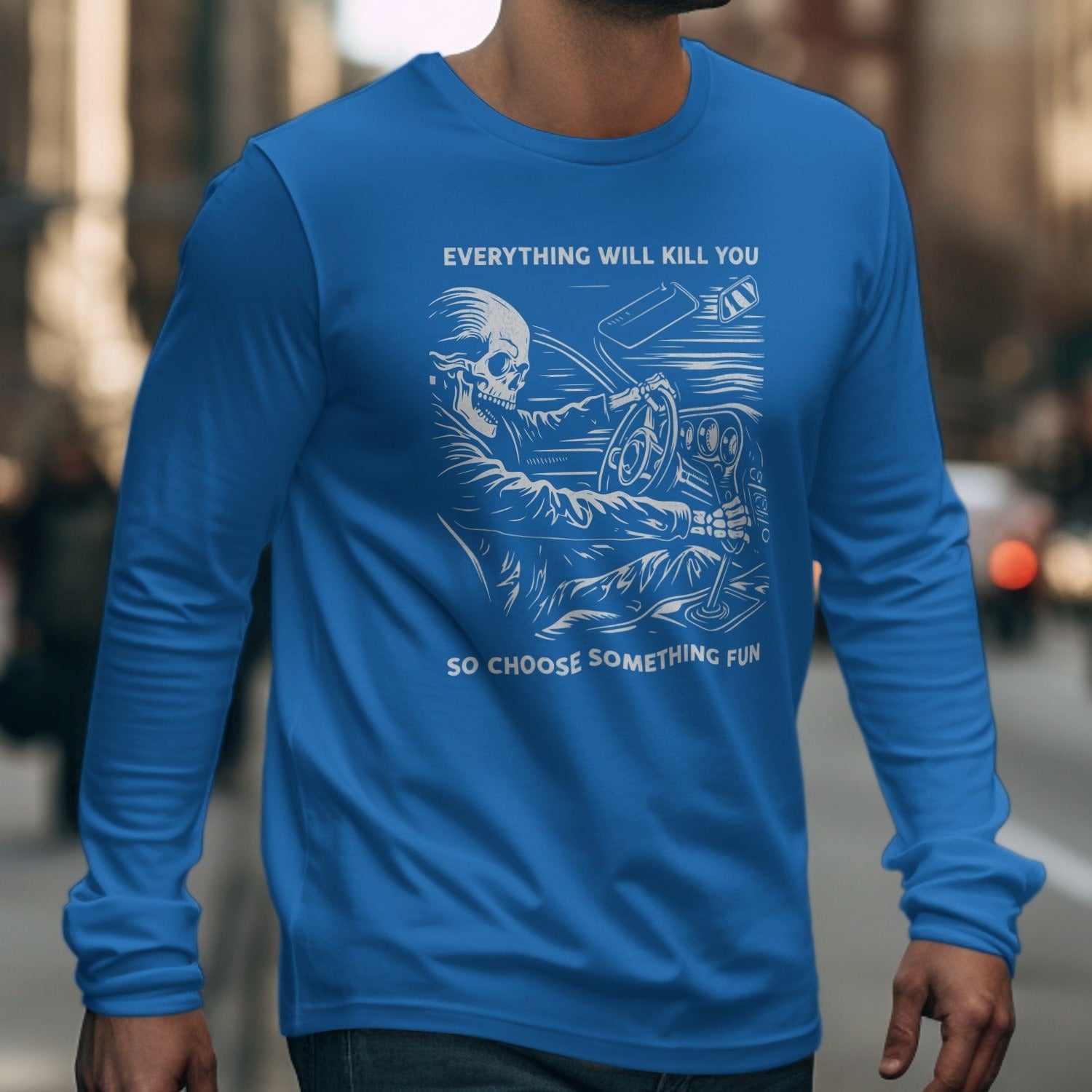 Blue long sleeve shirt with skeleton driving and text "Everything will kill you so choose something fun."