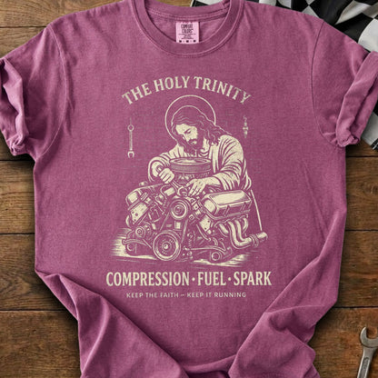 Jesus working on an engine with text "The Holy Trinity Compression Fuel Spark".