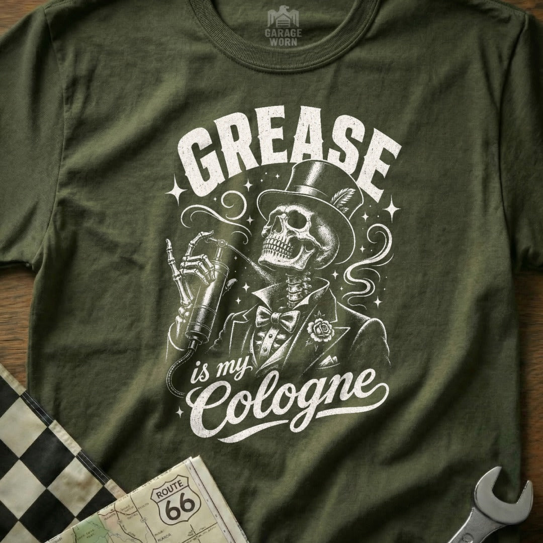 Green t-shirt with skeleton in suit and top hat, holding grease gun. "Grease is my Cologne."