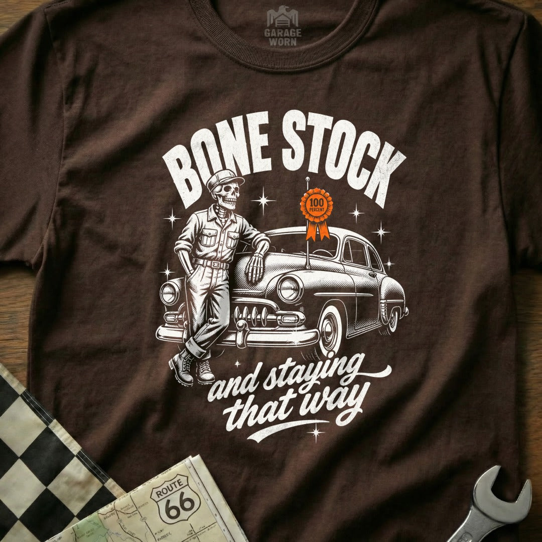 Skeleton leaning on classic car with text "Bone Stock and staying that way".