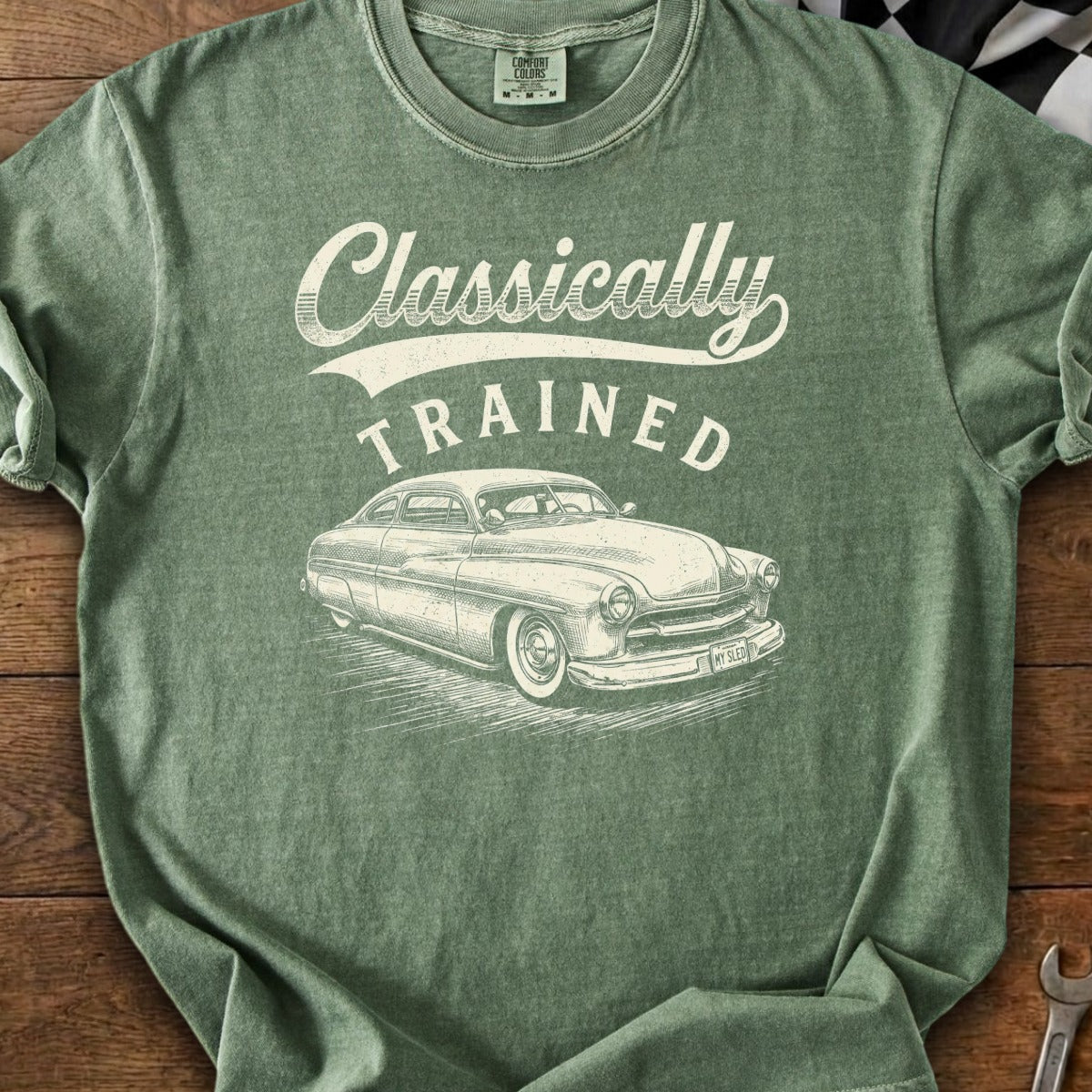Green T-shirt with "Classically TRAINED" text and vintage car illustration.