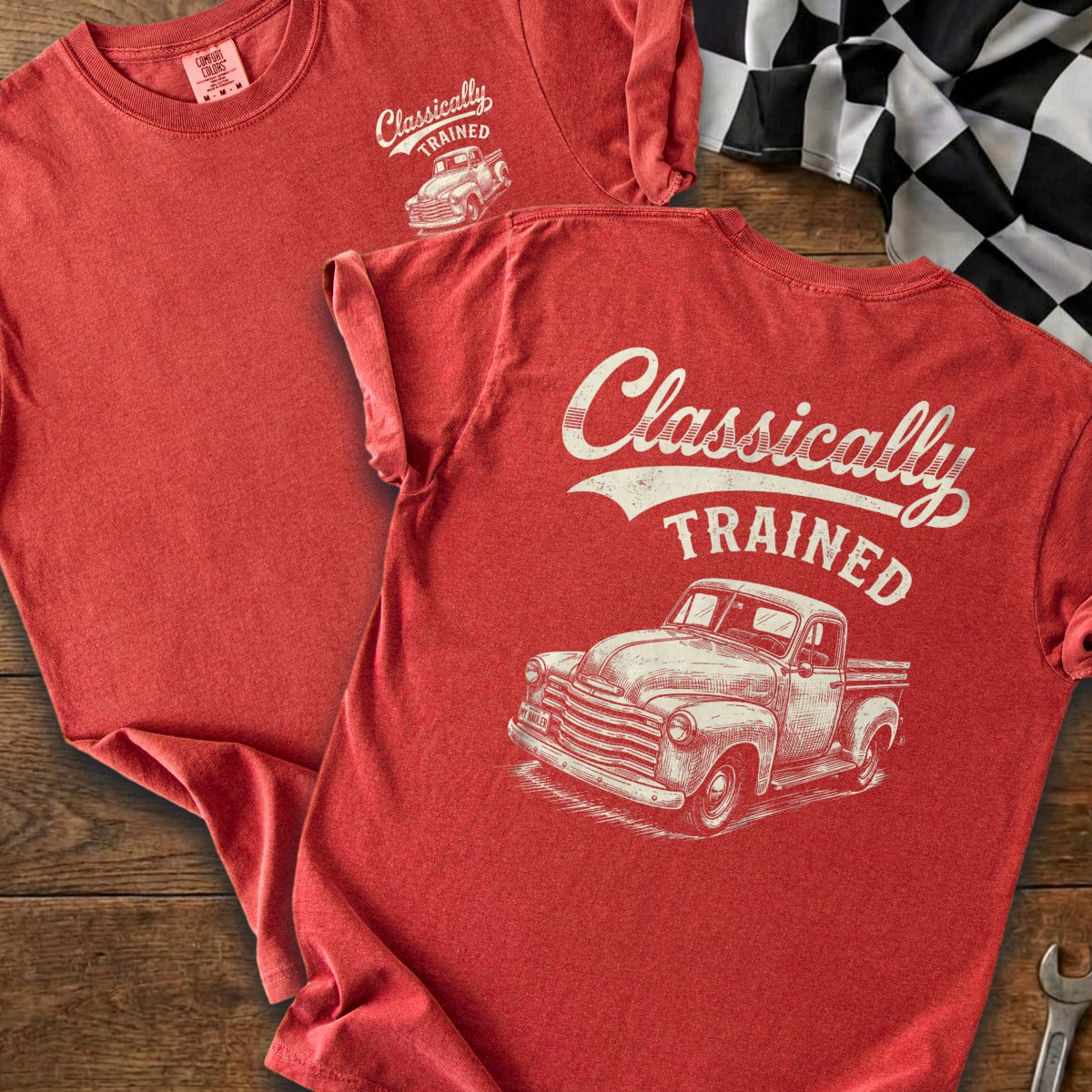 Red t-shirt, back graphic reads "Classically TRAINED" with vintage truck illustration.