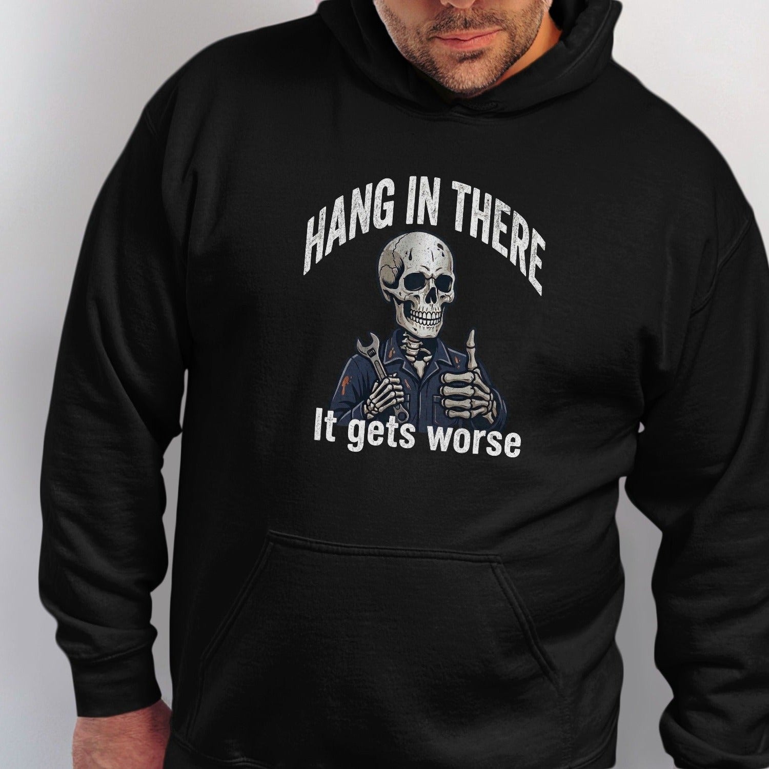 Skeleton mechanic holding a wrench, giving a thumbs up on a black hoodie with text.