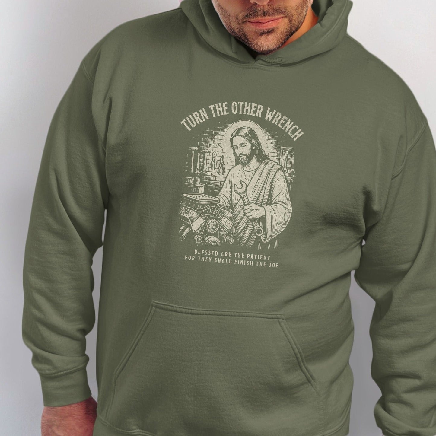 Jesus holding a wrench with text "turn the other wrench" and "blessed are the patient".