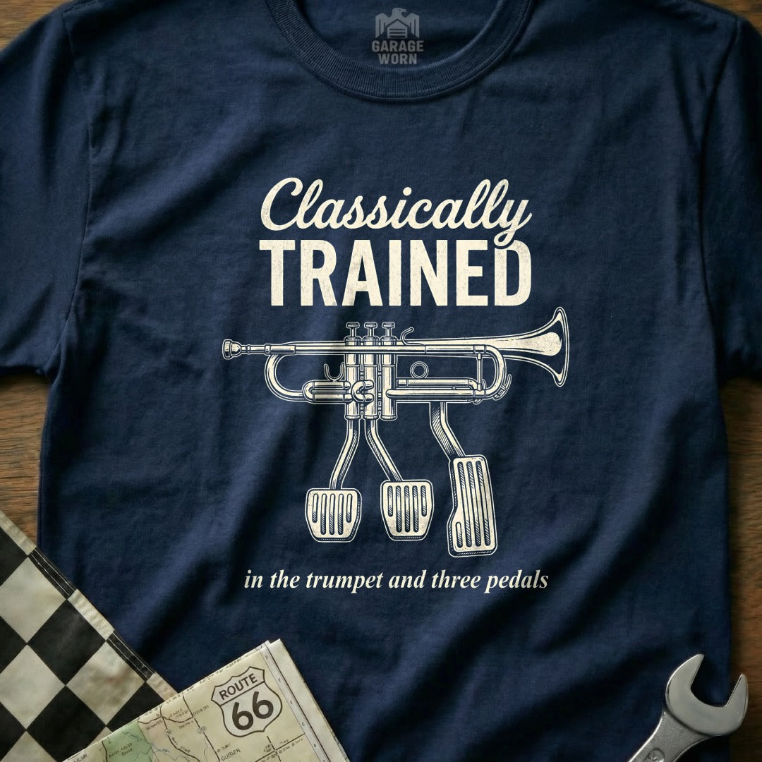 Navy t-shirt with trumpet and three pedals graphic; text "Classically Trained".