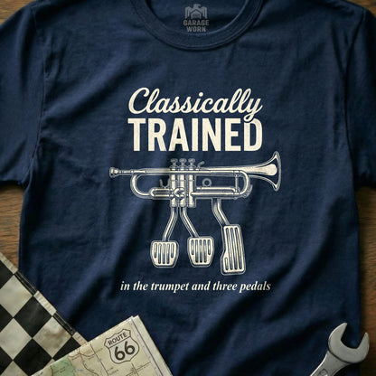 Navy t-shirt with trumpet and three pedals graphic; text "Classically Trained".