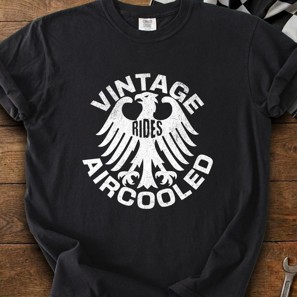 Black t-shirt with white distressed graphic "Vintage Rides Aircooled" and eagle crest.