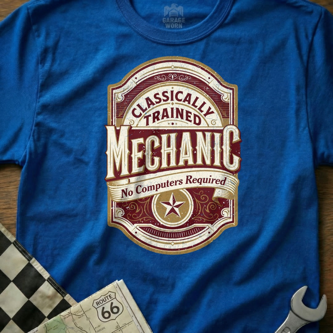 Classically Trained Mechanic No Computers Required text on a blue t-shirt.