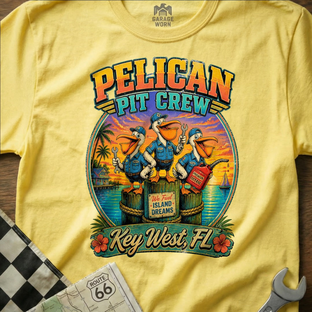 Pelican Pit Crew t-shirt with three pelicans holding tools and a gas can in Key West, FL.