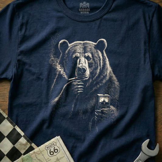 Bear smoking a cigarette holding a gauge on a dark navy t-shirt.