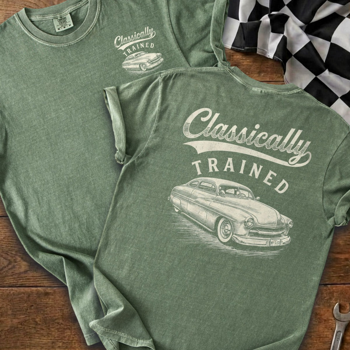 Green t-shirt with "Classically TRAINED" and classic car graphic.