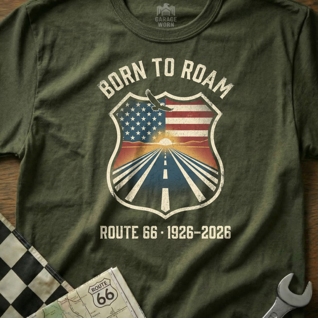 Olive green t-shirt with "Born to Roam Route 66 1926-2026" shield design.