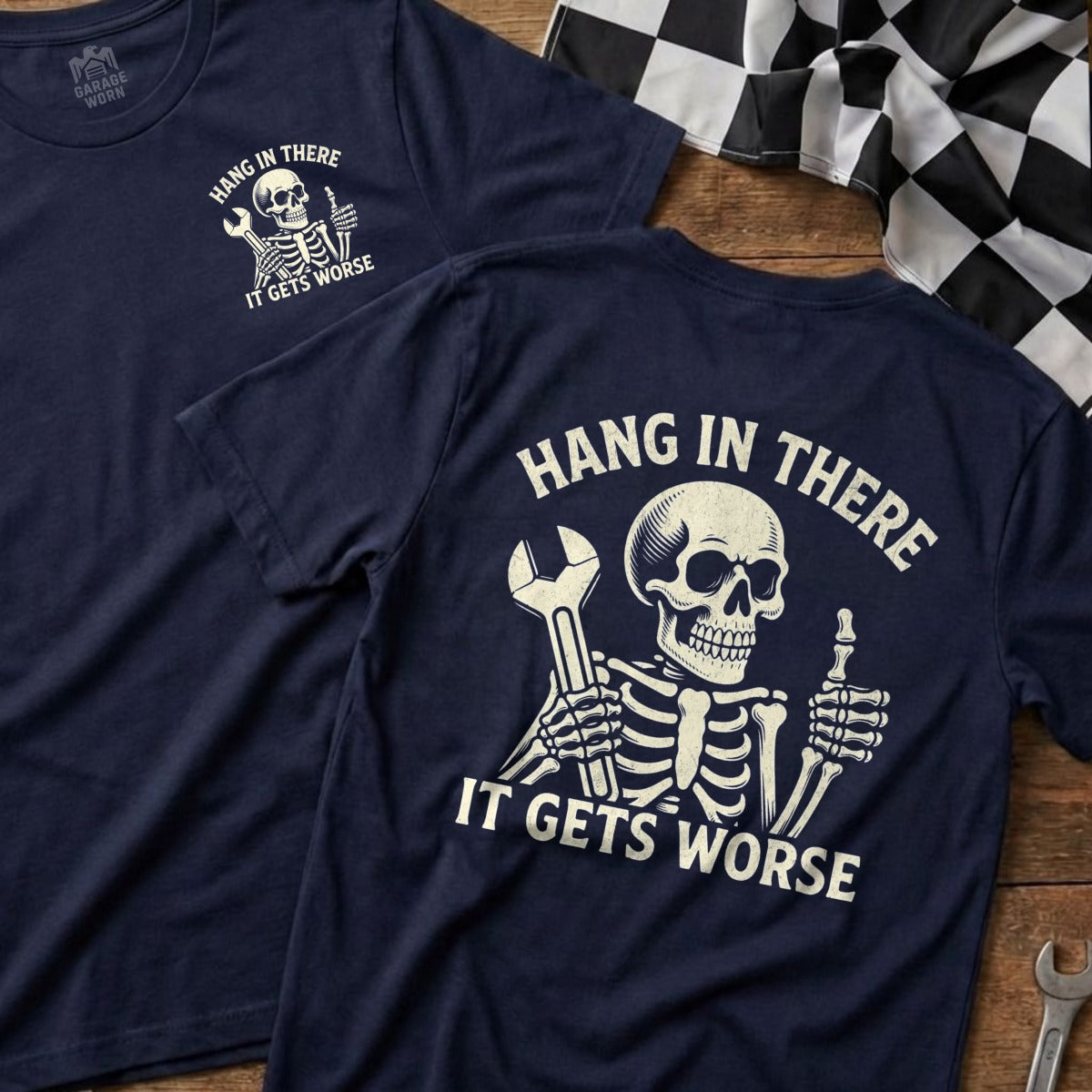 Navy t-shirt with skeleton holding wrench, "Hang in There It Gets Worse" text.